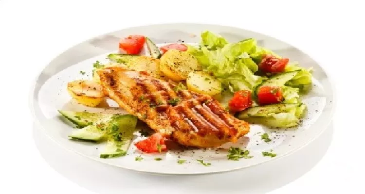 Muscle-building meal with chicken and veggies for natural exercises and supplements for male muscle strengthening