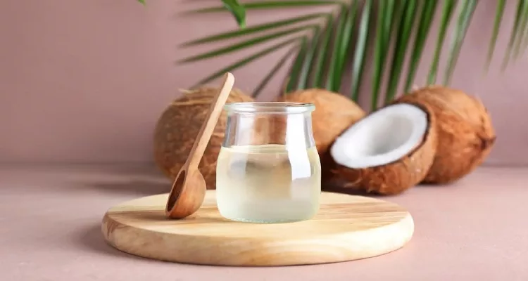A rustic kitchen scene with a jar of coconut oil, fresh coconuts, and a spoon, highlighting coconut oil’s health benefits