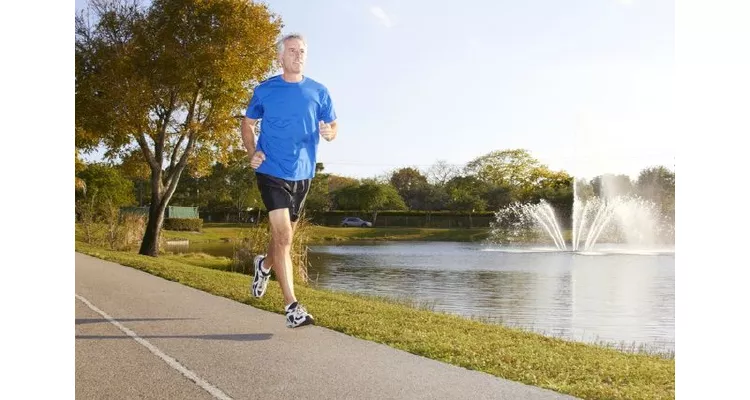 Person walking outdoors, embracing physical activity to control diabetes naturally